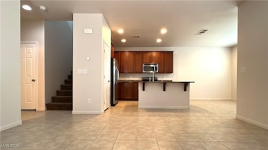 Kitchen featuring stainless steel appliances, dark