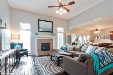 Hardwood floors, windows to the backyard showcase 