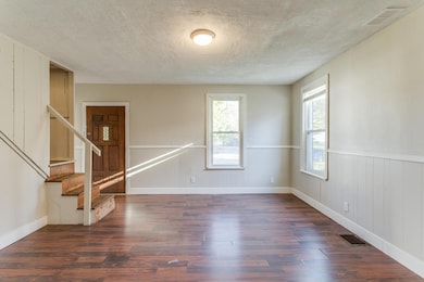 Stairway leads to 3 bedrooms