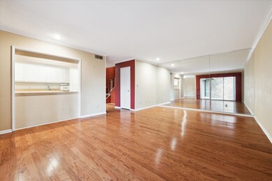 The living room features a pass-through to the kit