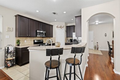 There is room for additional seating at the breakfast bar area.