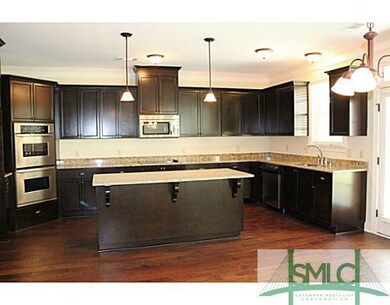 Kitchen. Featuring granite counter tops, hardwood 
