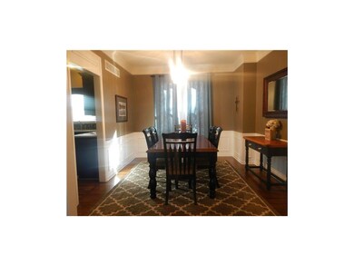 Large dining room with new wood floors, new light 