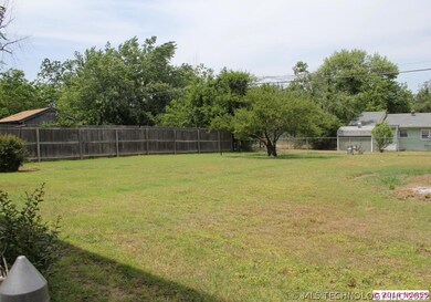 Large back yard with perfect garden spot.