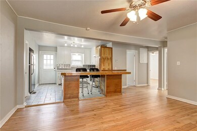 Open concept living with a bar for extra seating