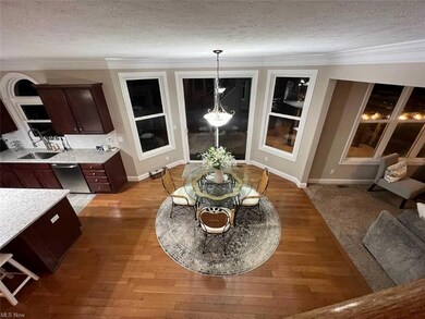 Lots of windows, patio door to deck, hardwood floo