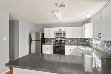 Stainless Refrigerator Stays.  Gas Stove.