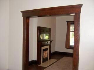 Looking into front room from second room