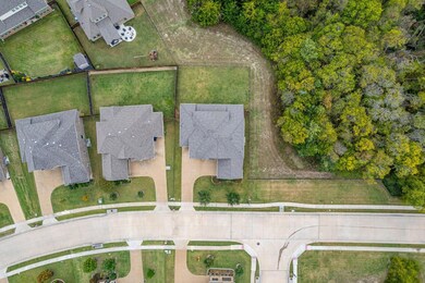 House is the one on the far right next to the gree