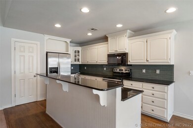 Additional view of kitchen includes gorgeous glass