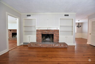 Living Room w/ Fireplace, Built Ins and Lots of Na