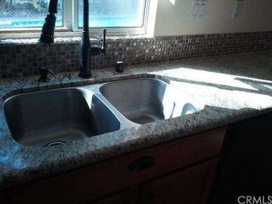 GRANITE AND GLASS BACK SPLASH WITH UPGRADED FAUCET