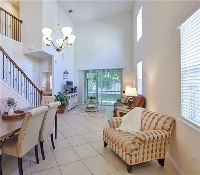 The volume ceilings and custom staircase make this room! 