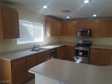 Kitchen featuring stainless steel appliances, ligh