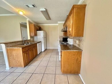 Kitchen with exhaust hood, tasteful backsplash, cr