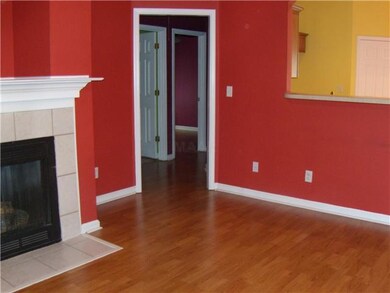 The living room features an open floor plan and fi