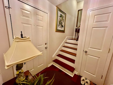 Welcome home to a grand foyer with stunning hardwo