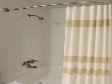 Full bath featuring shower / bathtub combination with curtain