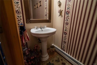 Convenient half bath, just off the Foyer for your 