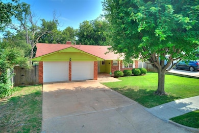 Ranch-style house with a garage, driveway, roof with shingles, and brick siding