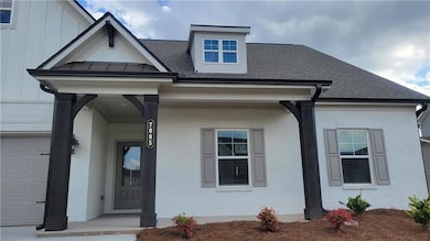 View of front of property featuring a garage