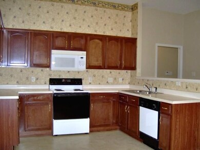 Pretty cherry finished cabinets and lots of counte
