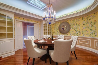 Entertain in the curved dining room. Note the atte