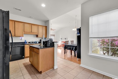 Kitchen featuring a wealth of natural light, visib