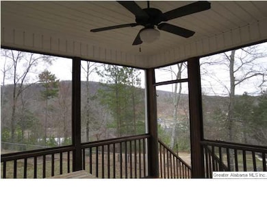 Screened in back deck overlooking fenced in backya