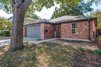 The double garage door, exterior trim and gutters 
