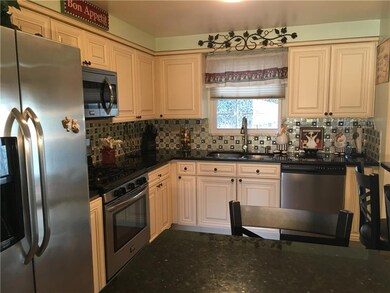 Kitchen is stunning with granite countertops tile 