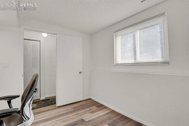 Unfurnished office featuring wood-type flooring an