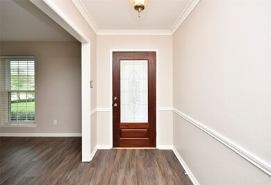 Standing in the foyer looking toward the front doo