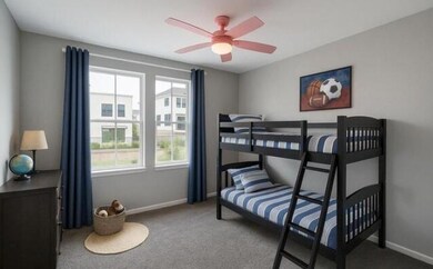 Bedroom featuring carpet flooring, baseboards, and