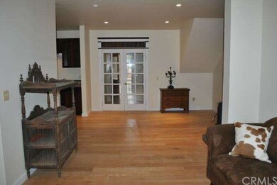 living room facing french doors and front door ent