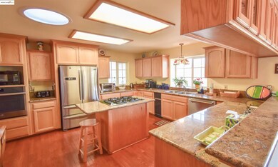 Granite countertops, stainless appliances, restained hardwood flooring throughout most of main level.