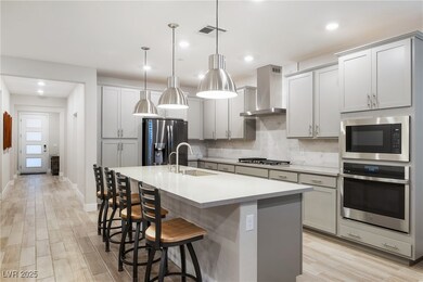 Kitchen featuring a breakfast bar area, stainless