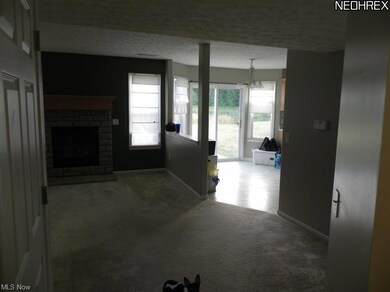 A view walking in the front door with the Great room straight ahead and the dinette area to the right!
