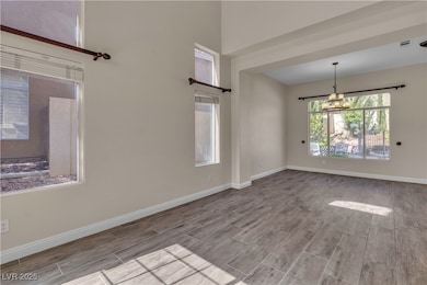 Spare room with wood finished floors, baseboards,