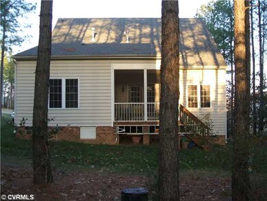 Exterior Back - Wooded yard with screened porch