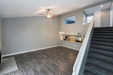 Family and kitchen area open with high ceilings an