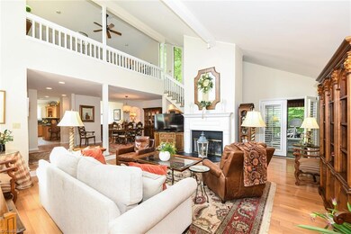 Living Room/Great Room view showing vaulted ceiling and balcony to upper bonus room.