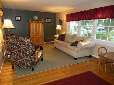 Living Room Gleaming hardwoods throughout and upda
