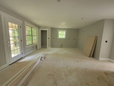 Kitchen with island, pantry, granite counters and tile back splash