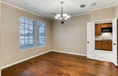 The two-story entry opens to the formal dining roo