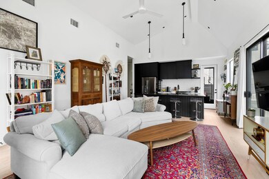 Living room with high vaulted ceiling, a ceiling 