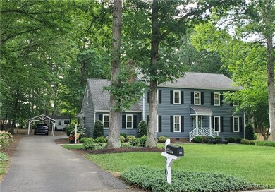 Colonial inspired home with roof with shingles, a