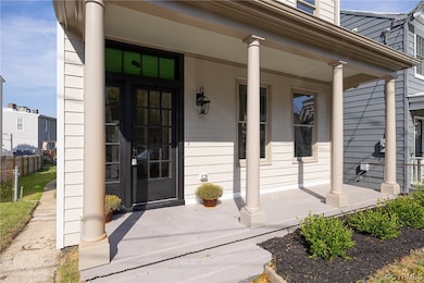Entrance to property featuring a porch