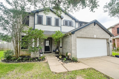 This charming two-story home features a gray brick