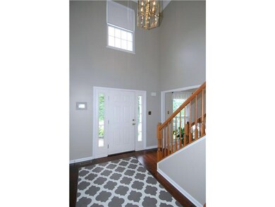 Entry/Foyer. Dramatic vaulted entry has crown mold